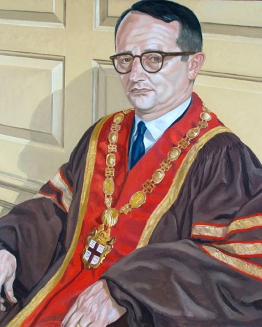 seated color portrait of a man in doctoral robes